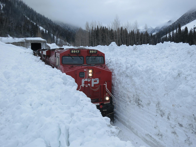 train-going-through-huge-snow-wall-in-canada